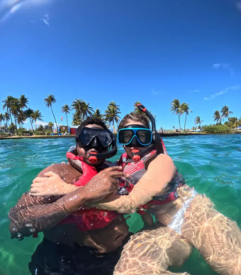 Guided snorkeling group exploring underwater reef ecosystems at Turtle Bay on a San Juan Puerto Rico snorkeling tour with hotel pickup